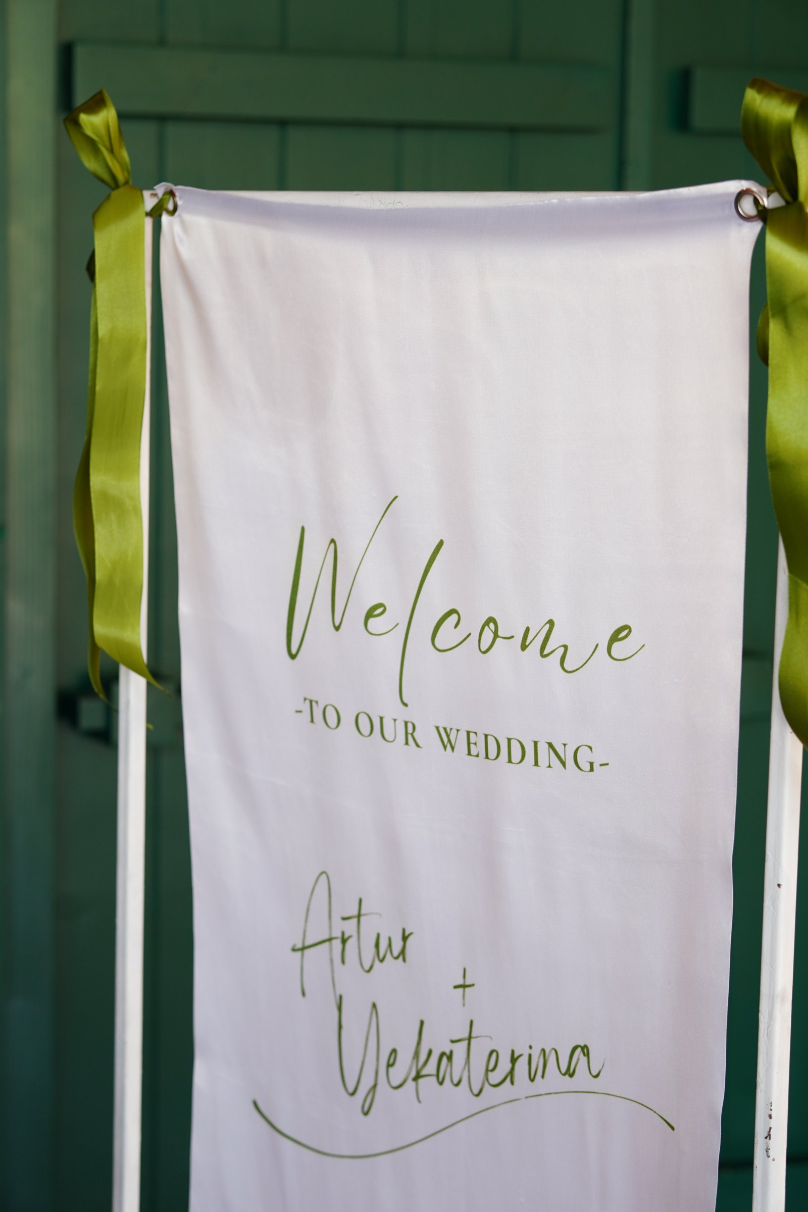 Welcome sign with the couple's names at the entrance to the estate