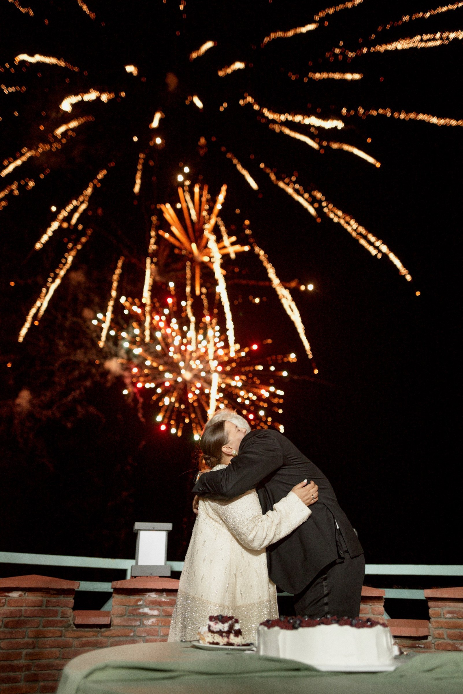 Fireworks over the couple's embrace at the end of the night