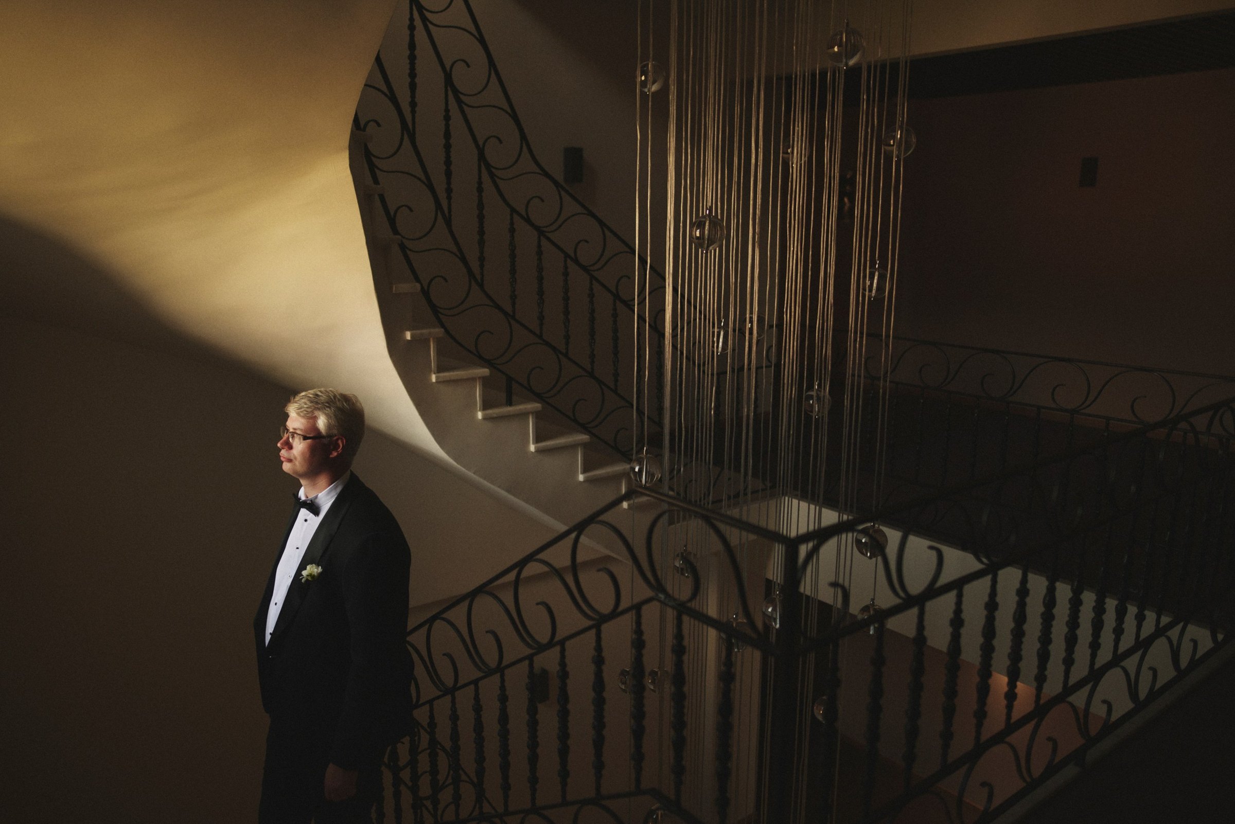 Groom on the castle staircase before the ceremony