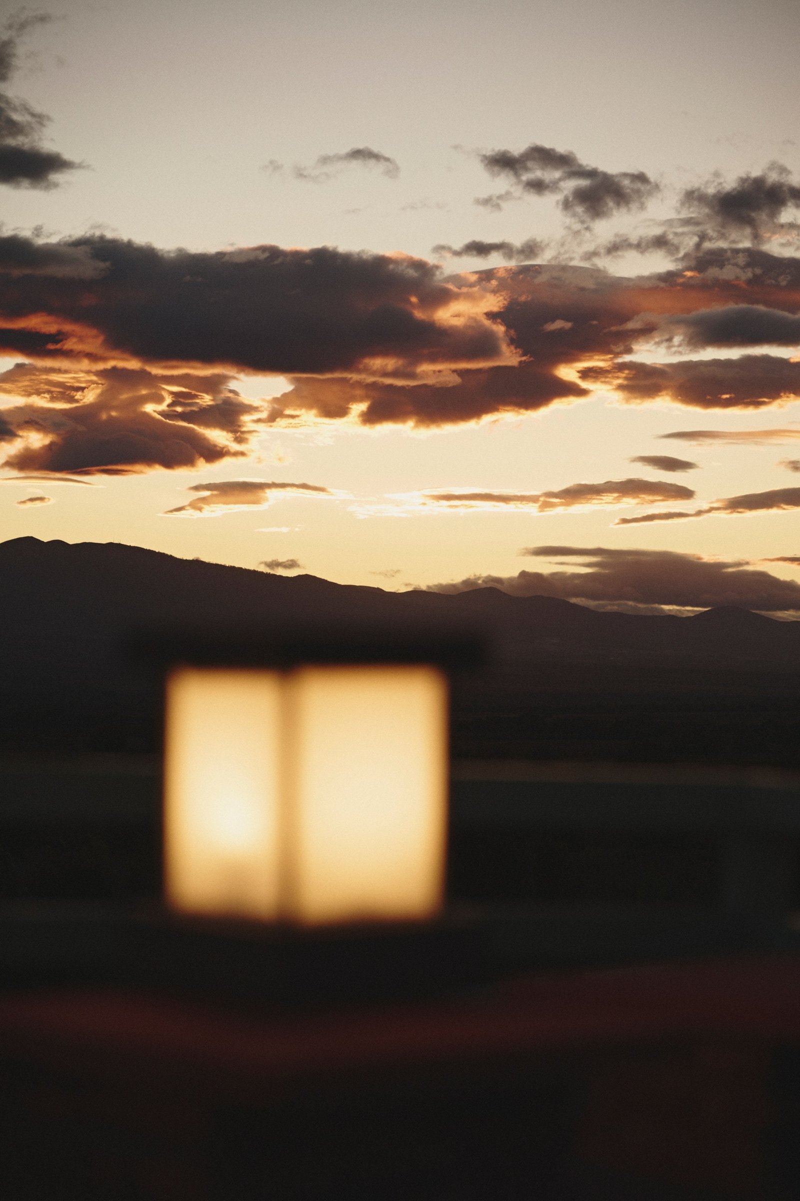Dusk over the valley, a lantern lit on the terrace