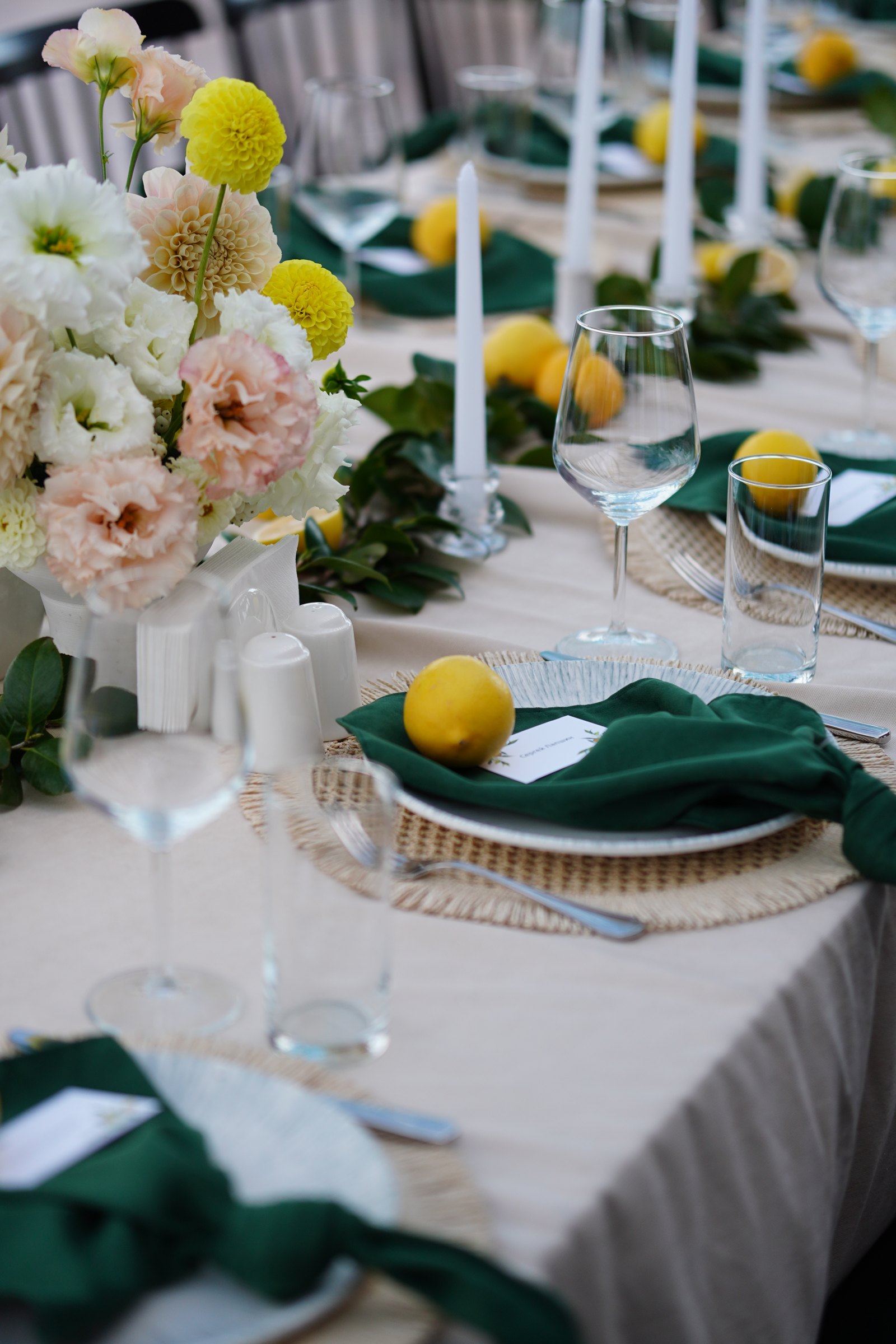 Wedding table setting with lemons and yellow florals