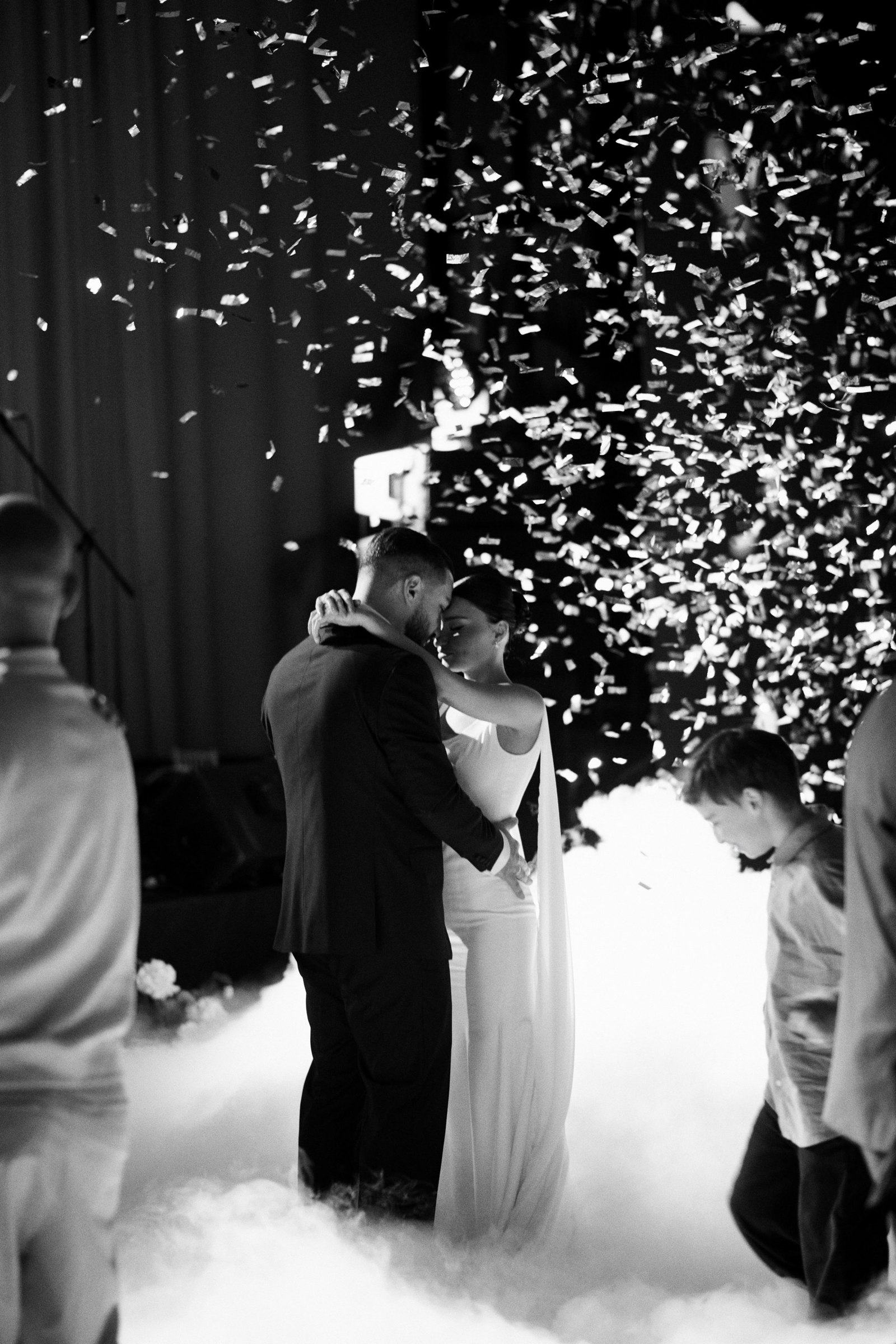 First dance in falling confetti and low fog