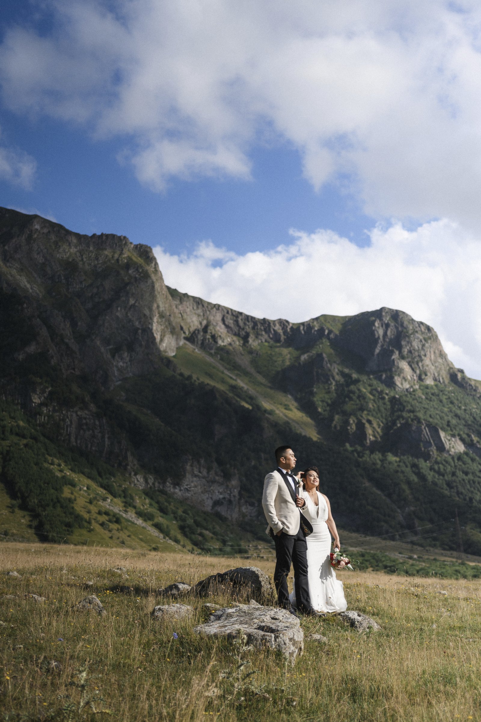 The couple on the rocks above the valley