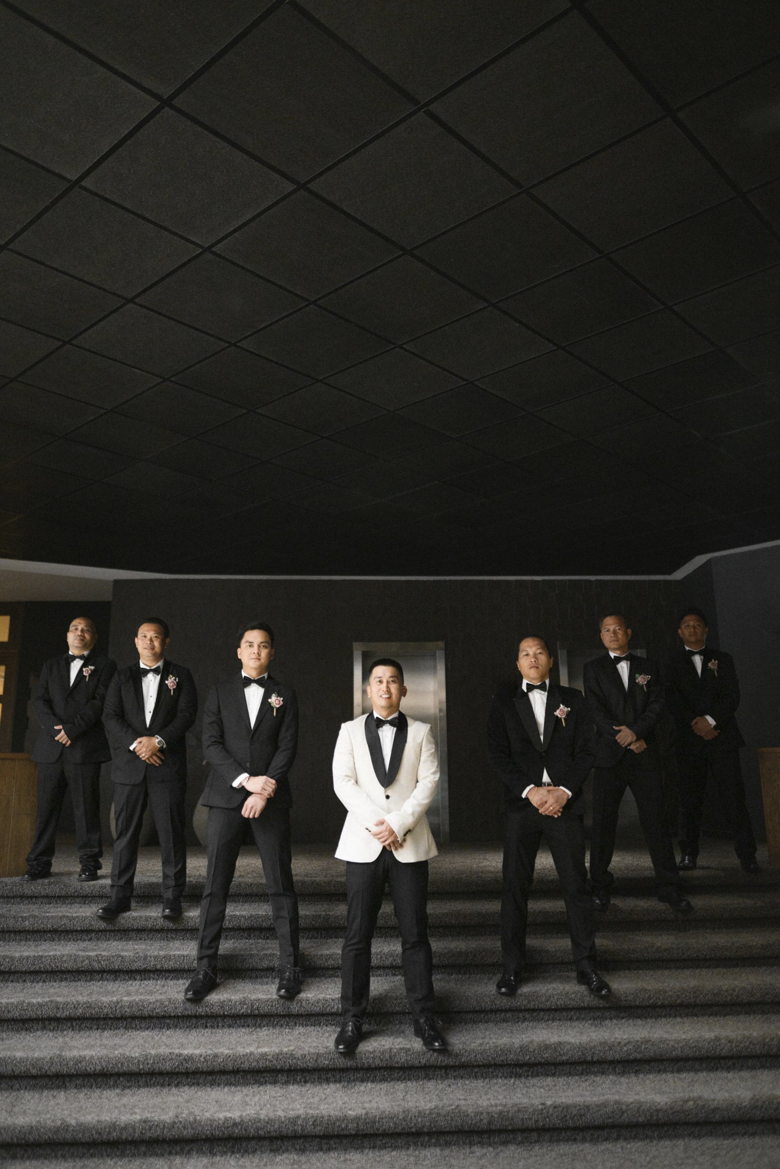 The groom and his men on the hotel steps