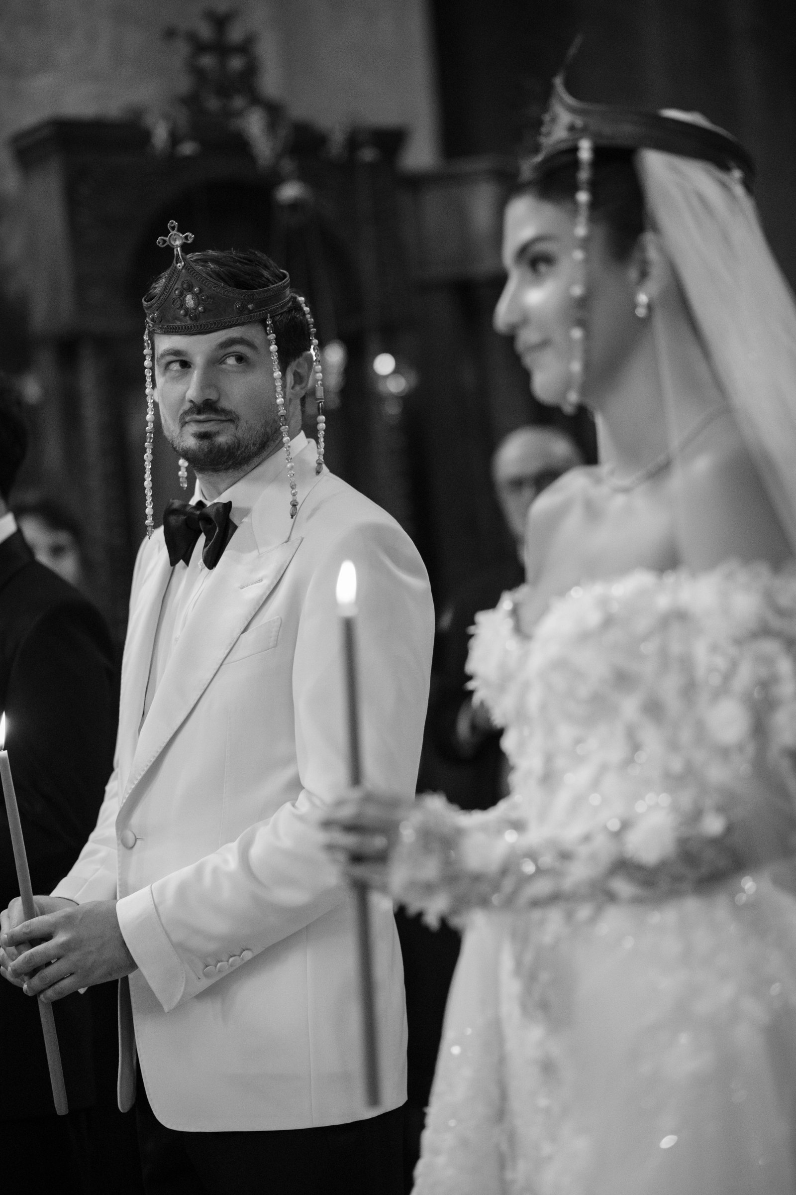Crowns held over the couple in the cathedral, black and white