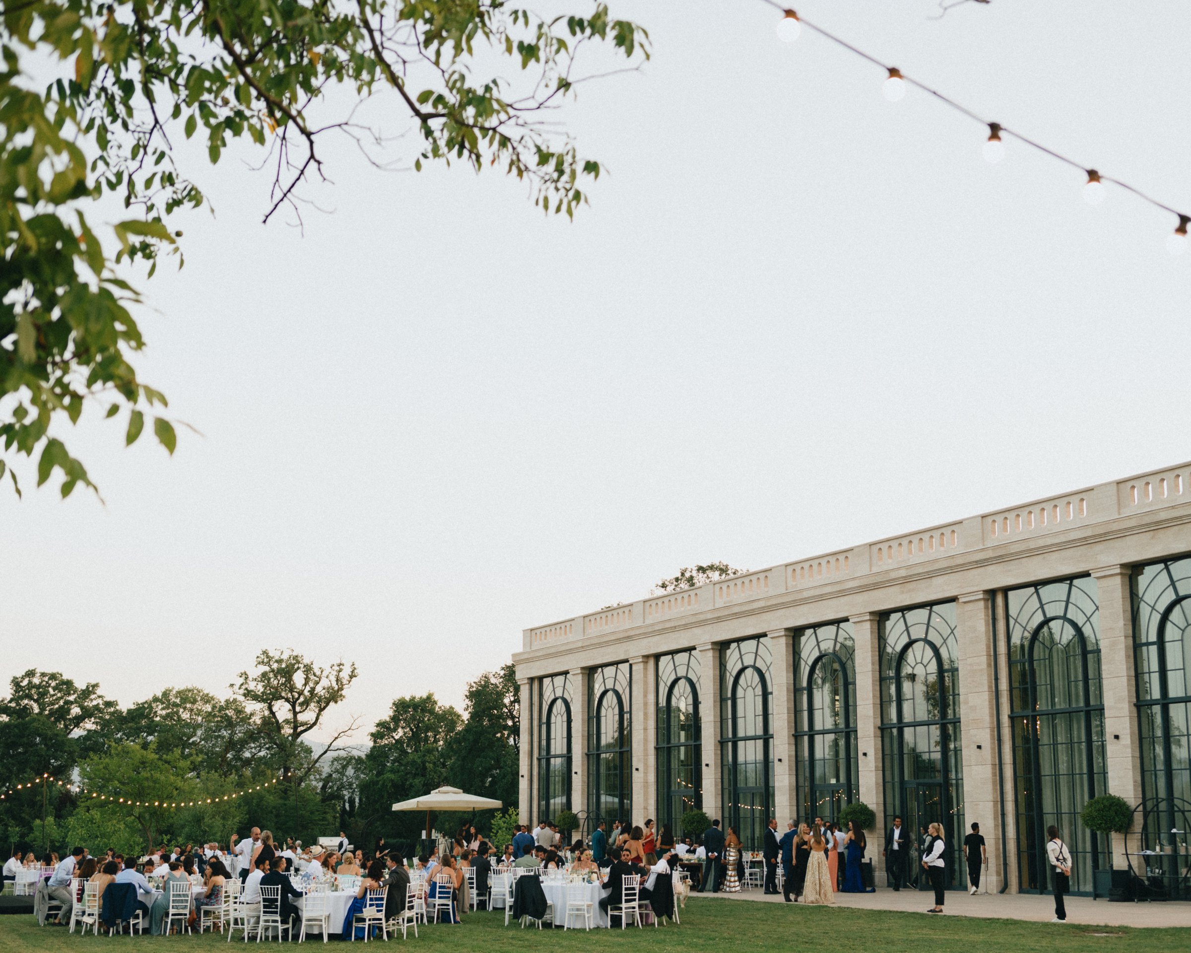 Dinner on the lawn as the orangery lights up