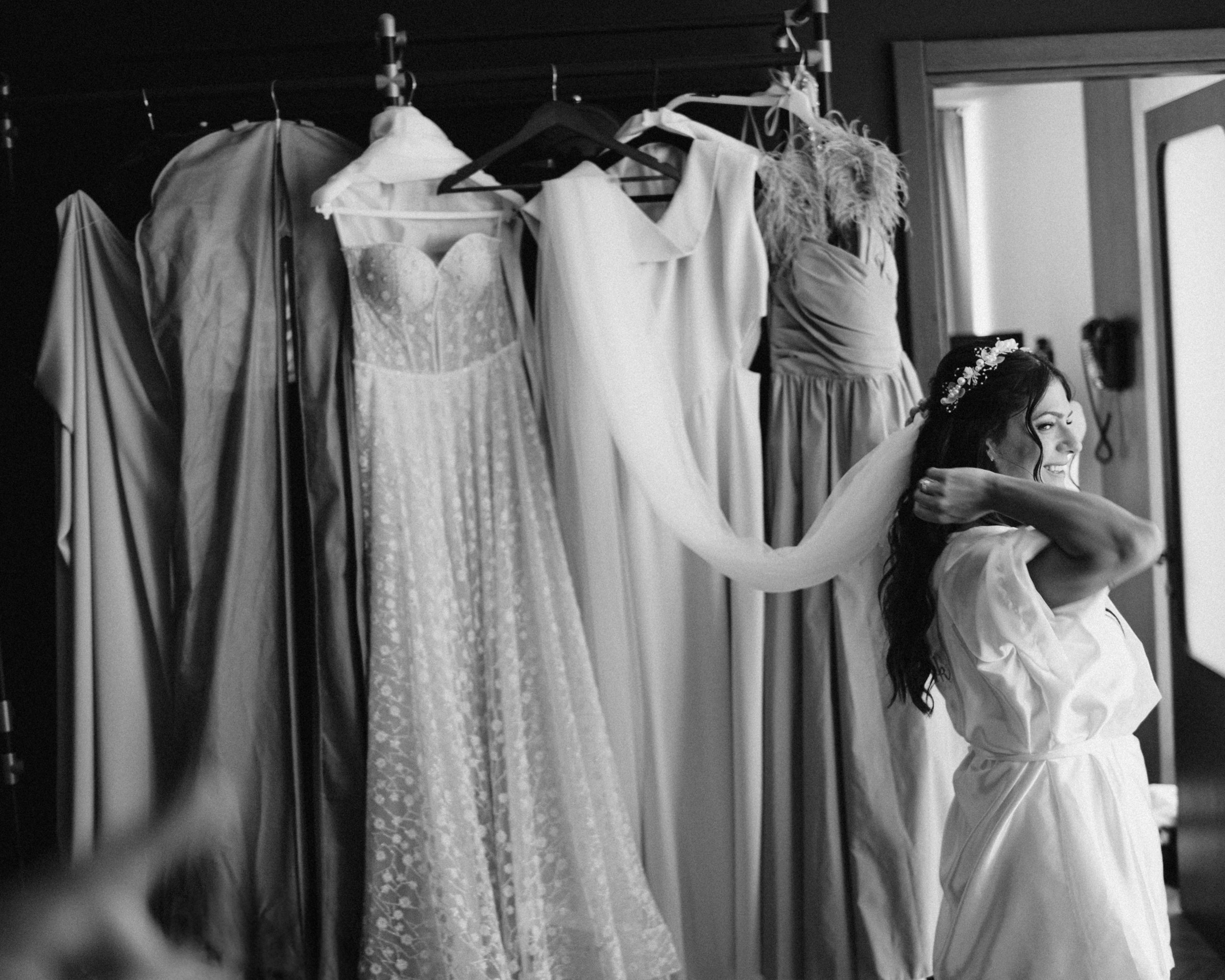 Three dresses waiting by the window, black and white