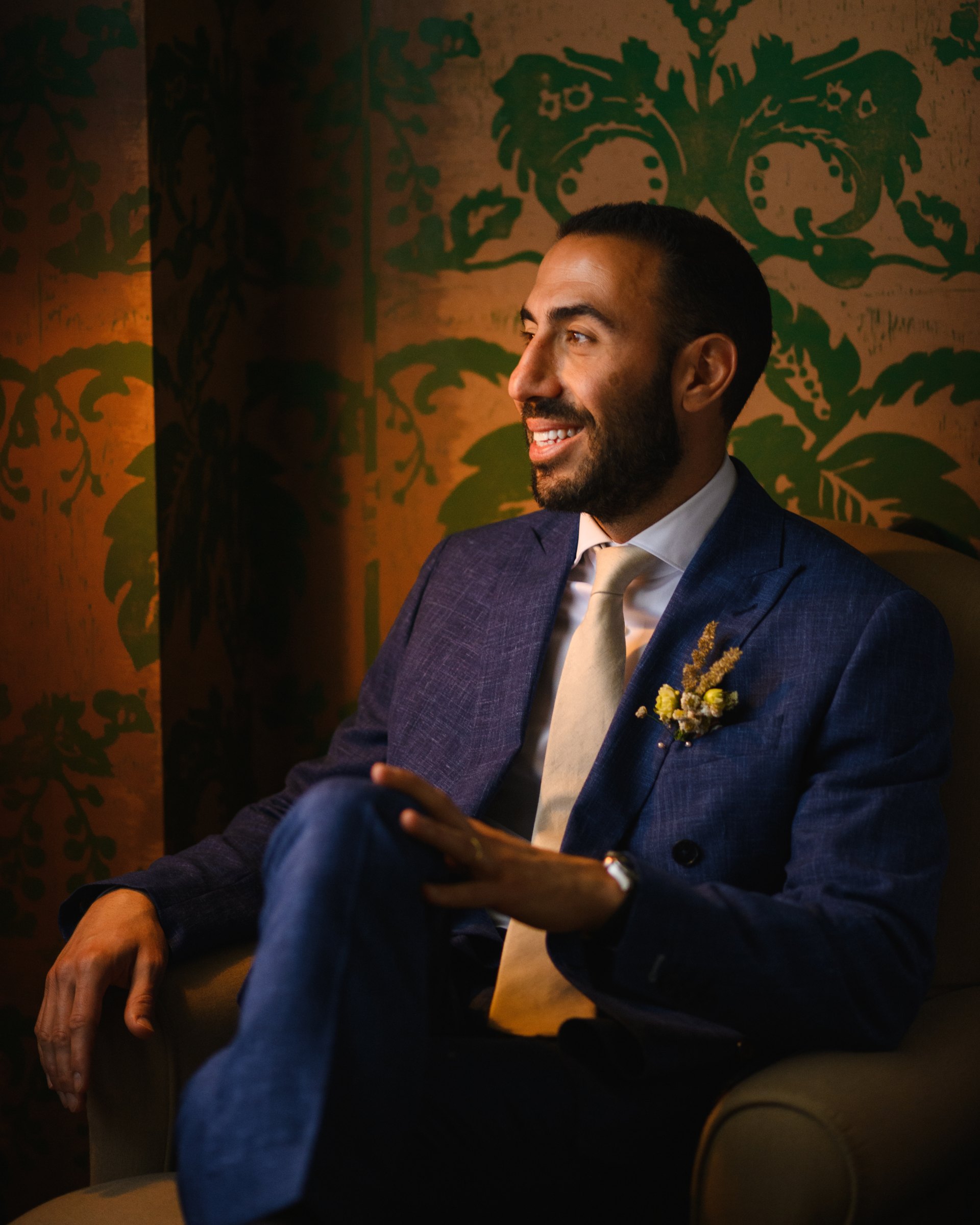 The groom in the green salon before the first look